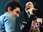 The couple that sings together... Katy Perry surprises fans as she joins John Mayer in concert to perform their duet Who You Love