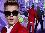 Can't tag along! Justin Bieber suffers epic graffiti fail as he tries to take over from street artist Alec Monopoly