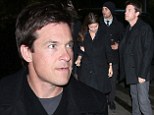 Look smart! Jason Bateman cuts a dapper figure in black coat and grey trousers as he enjoys night out at Chateau Marmont