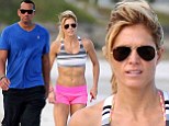 Better hit the gym A-Rod! Torrie Wilson shows up her professional sportsman beau baring her ab-tastic stomach on the beach