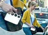 Cameron Diaz gives her outfit an edgy twist with her favourite knuckleduster phone case