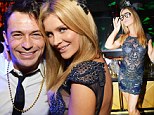 Too cool: Joanna Krupa turned on the heat while posing for photos during a New Year's Eve bash at the nightclub her husband Romain Zago owns in Miami - Mynt