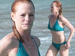 Fabulous at 55! CSI's Marg Helgenberger displays her enviable bikini body while soaking up the sun in St Barts