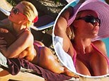 'It's 31 degrees in NYC - obviously I'm not there!' Coco Austin displays her near-naked body in G-string bikini while sunbathing in the Caribbean