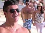 What a difference a year makes! Simon Cowell ends 2013 with a romantic beach stroll in Barbados with pregnant girlfriend