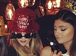Khloe Kardashian opts for red sparkly hat and silly glasses as she welcomes in new year with sister Kylie Jenner