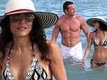 Bikini clad Bethenny Frankel puts divorce troubles behind her to enjoy a dip with hunky mystery man at Miami Beach