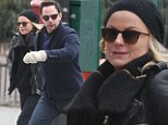 Amy Poehler looks chic in all-black as she enjoys her last bit of holiday recreation with beau Nick Kroll as Golden Globes hosting gig approaches