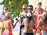 Girls allowed: 'The X Factor' judge took time to chat and pose with female fans before taking a jetski ride
