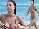 Smoking hot! Model Julia Pereira raises temperatures as she hits Miami Beach in a striped bikini