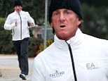 Sean Penn looks out of breath as he endures post-holiday jog after returning from Hawaii with Charlize Theron