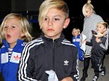 Kingston and Zuma Rossdale show off their street cred in sporty tracksuits and fun footwear at LAX with mom Gwen Stefani