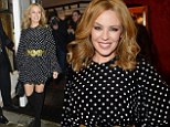 Kylie Minogue sexes up her pretty polka dot dress with thigh-high boots for Dolce and Gabbana's London Collections party