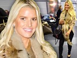 Making an entrance! Jessica Simpson turns the airport arrivals lounge into a fashion show in tight leather pants
