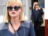 Pulling double duty! Reese Witherspoon picks up her dry cleaning in chic blue jacket and heels after business power lunch