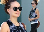 Work it, baby! Bare-faced Olivia Wilde shows off her pregnancy bump in tie-dye top and leggings while dashing to the gym