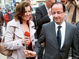 Hospitalised: Francois Hollande, right, offers a rose to his Valerie Trierweiler, in Tulle, southwestern France