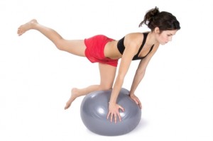 Women balancing on a swiss ball