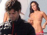 Adrian Grenier parties with topless girls on a yacht while filming the Entourage movie... and makes sure to capture it all on camera