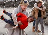 Charlize Theron and Sean Penn can't hide their affection as they cuddle and dote on her two-year-old during beach stroll