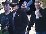Which one's the teenager again? Johnny Depp, 50, drops daughter, 14, at school before grabbing a pipe and sloping off with Marilyn Manson