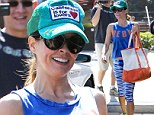 Athletic chic: Brooke Burke-Charvet showcased her incredible figure in a sporty and flashy outfit while out in Malibu in Los Angeles on Sunday with her daughter Heaven Rain