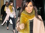 Kim Kardashian takes foxy lady look too far with bizarre furry scarf as she heads out on date with Kanye West