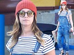 Throwback Sunday? Ashley Tisdale flashes her tummy as she brings back the 90s in dungarees and a crop top