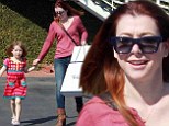 Still smiling! Seemingly perpetually happy actress Alyson Hannigan beams as she walks with daughter despite How I Met Your Mother coming to an end