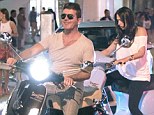 No helmets? Simon Cowell and Lauren Silverman headed out on scooters in Miami on Tuesday night