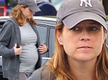 Bumping along: Jenna Fischer showed off a very swollen stomach, the fabric of her shirt stretched over her protruding bump as she stopped at a gas station in Los Angeles on Sunday