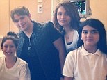 Making dad proud! Prince, Paris and Blanket Jackson pose with a sick patient during visit to a children's hospital