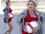 Playing it safe! Pregnant Elsa Pataky paints a life preserver on her burgeoning bare belly for a beach photo shoot