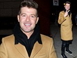Robin Thicke pastes on a smile as he emerges from restaurant after attempts to win back wife Paula Patton fail