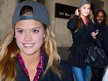 Well, that's different! Swimsuit model Nina Agdal covers up for a change