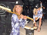 Audrina Patridge smashes a guitar into pieces at the launch of Hard Rock Palm Springs Hotel