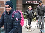 Playful in pink! Hugh Jackman taps into his inner child by wearing a bright backpack during family outing
