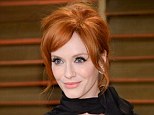 Flame-haired siren: Christina Hendricks, pictured here at last weeks Oscars, shares her beauty tips in the April edition of Redbook and reveals she is actually a natural blonde