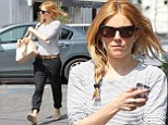 Sienna Miller styles her recently-dyed red hair into a messy side plait while grabbing lunch in Beverly Hills