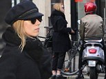 Scarlett Johansson covers up her baby bump with heavy coat as she emerges for first time since 'pregnancy' was revealed