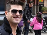 Happy birthday! Robin Thicke received an early birthday gift from a young fan while out in New York City on Friday
