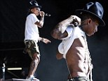 He's Happy with his abs! Pharrell Williams, 40, strips off for the crowd to show his age defying physique at Future Music Festival
