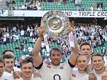 Success: Chris Robshaw raises the Triple Crown after England beat Wales 29-18
