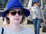 She's all HAT! Emma Roberts tries to keep a low profile in a blue fedora and sunglasses while running errands