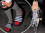 Rita Ora heads out in socks and sandals