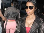 More like Pink Monday! Nicki Minaj teams figure-hugging jeans with heavily studded jacket and bag as she flies home with Safaree Samuels