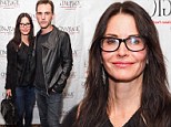 Courteney Cox brings out her inner geek with thick-rimmed glasses at event with boyfriend Johnny McDaid