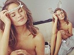 Calling Hugh Hefner! Model Chrissy Teigen has a Playboy moment as she tries on bunny ears while posing naked