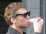 Thirsty: Sam Worthington was spotted in Sydney drinking strawberry milk