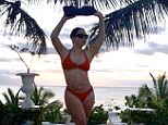 Killer curves: Mariah Carey shows off her curvy figure in a bright red bikini via her Instagram account on Wednesday